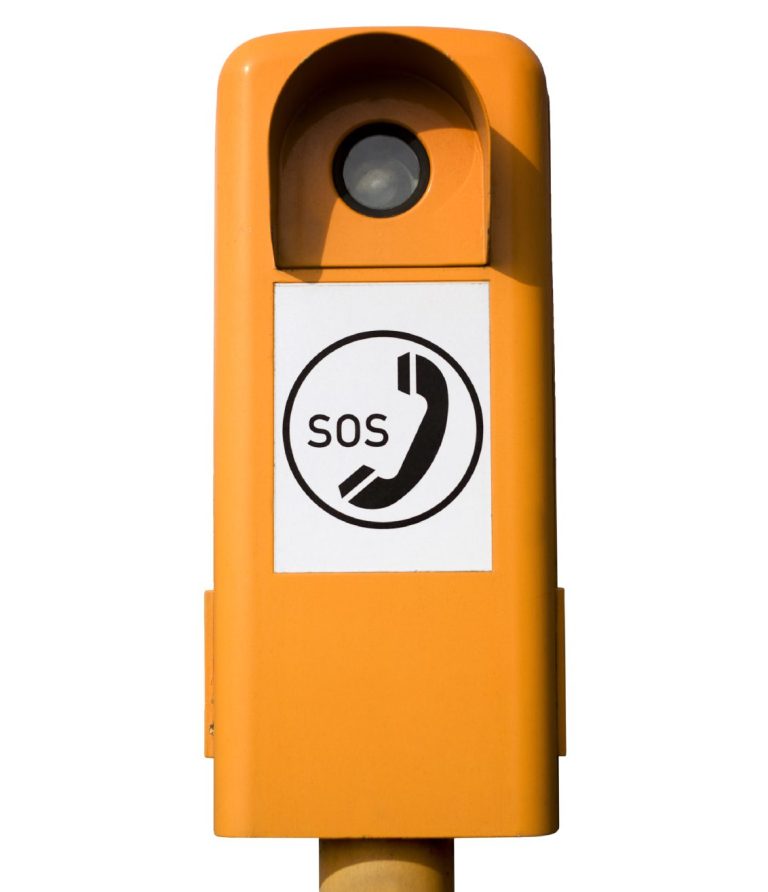 Gelbe Notsäule mit SOS-Symbol und Telefonhörer.